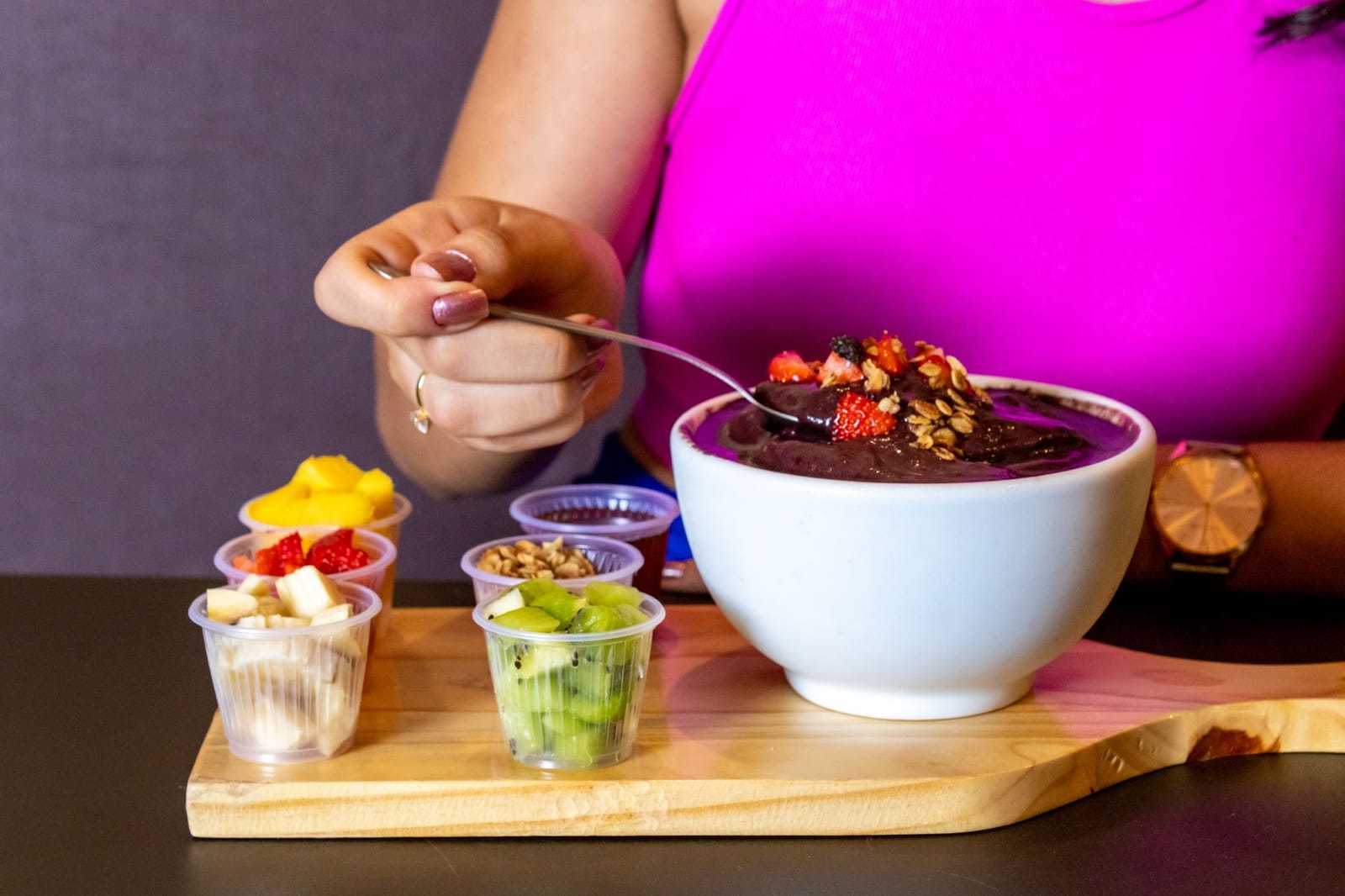 Dark purple acai puree on a spoon