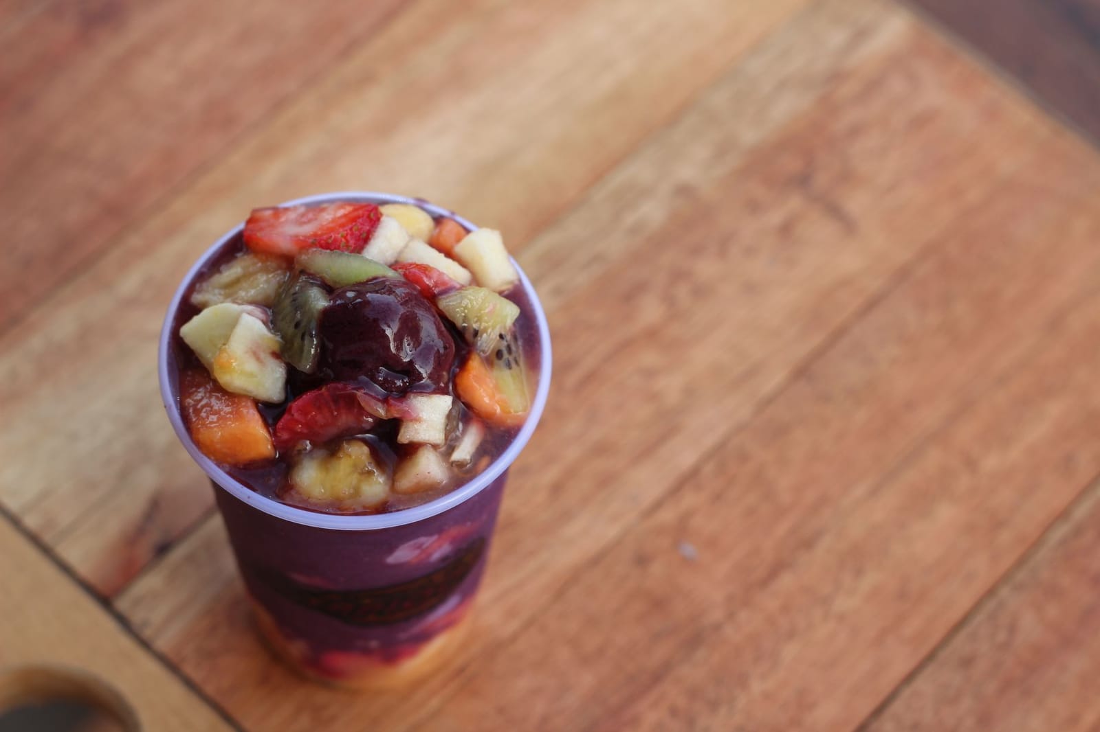 A purple acai smoothie in a glass