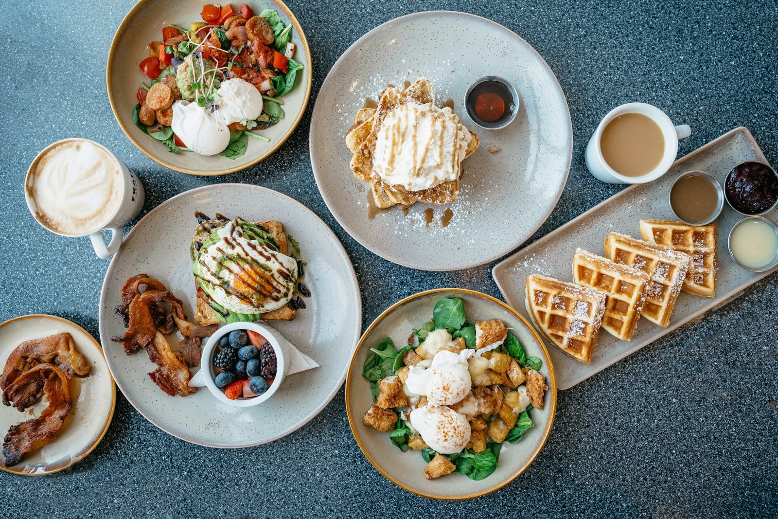 Coffee and brunch spread on a Southport cafe table