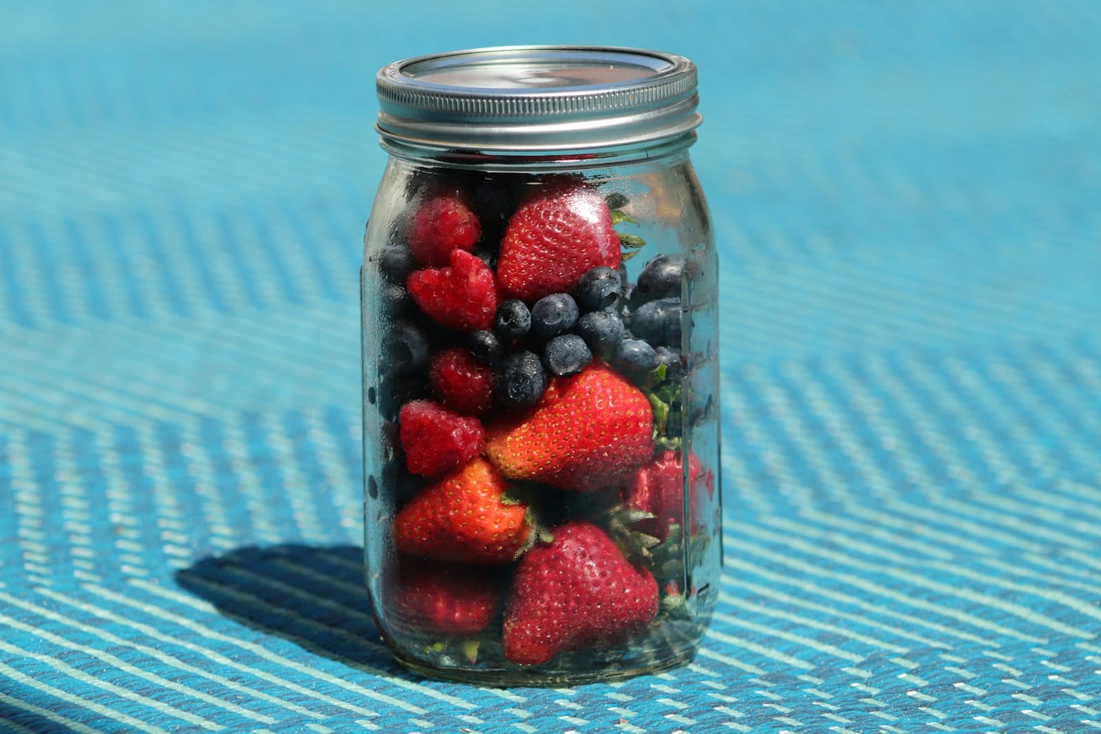 Overnight oats in a jar topped with berries
