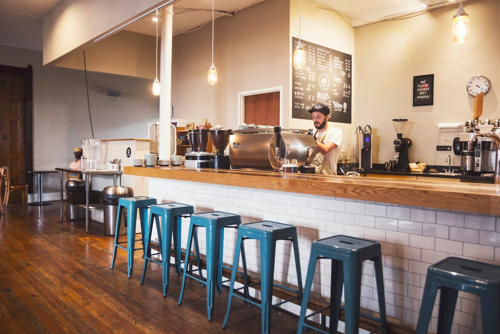 Barista pulling an espresso shot at a precinct cafe