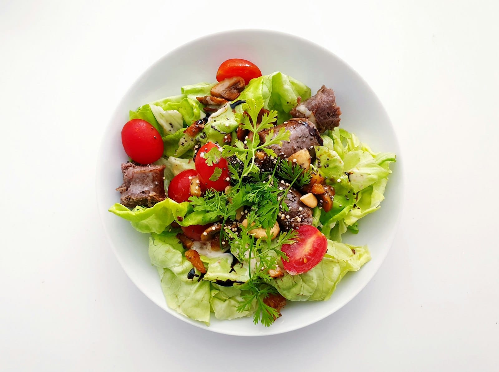Fresh gluten-free salad bowl with greens and seeds
