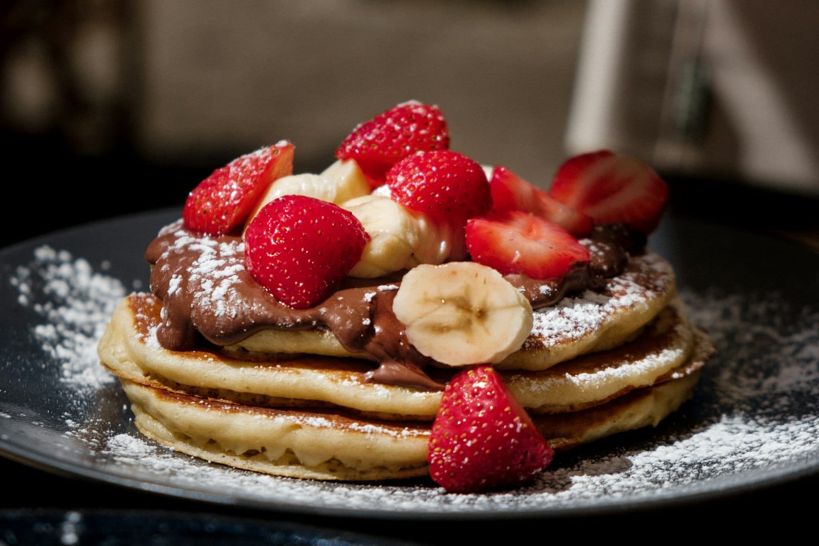 Gluten-free pancakes topped with fresh fruit