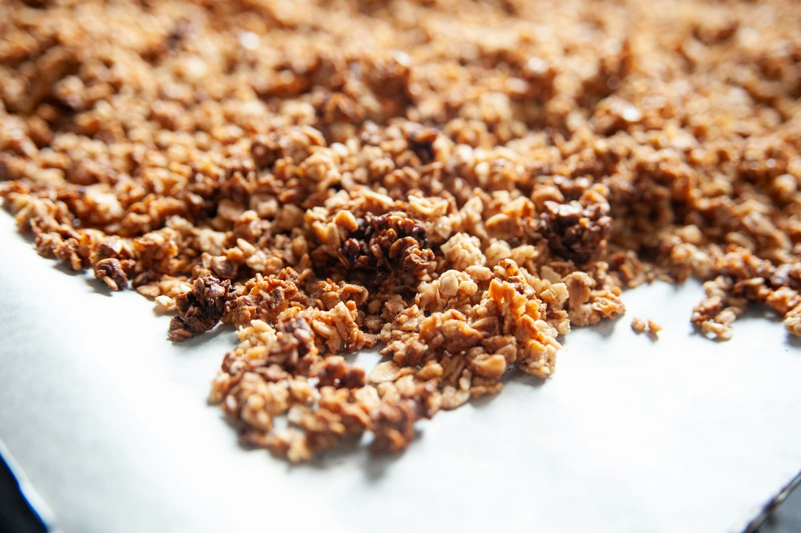 Granola spread on a baking tray
