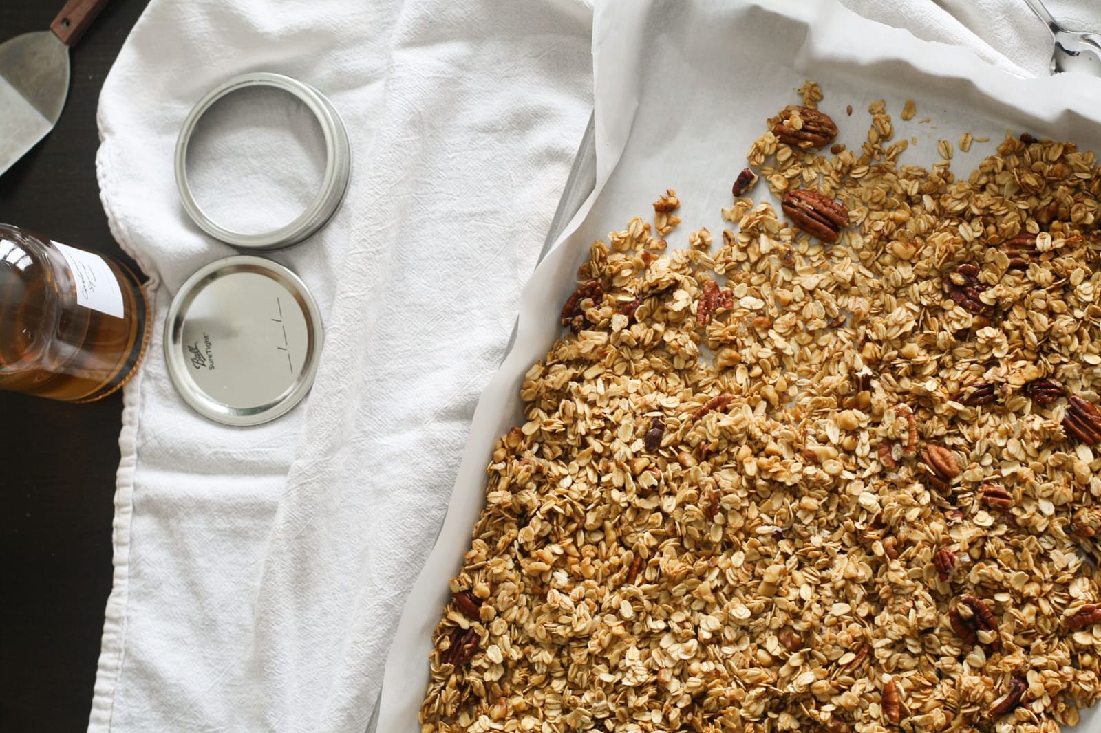 Maple syrup drizzled over granola mixture