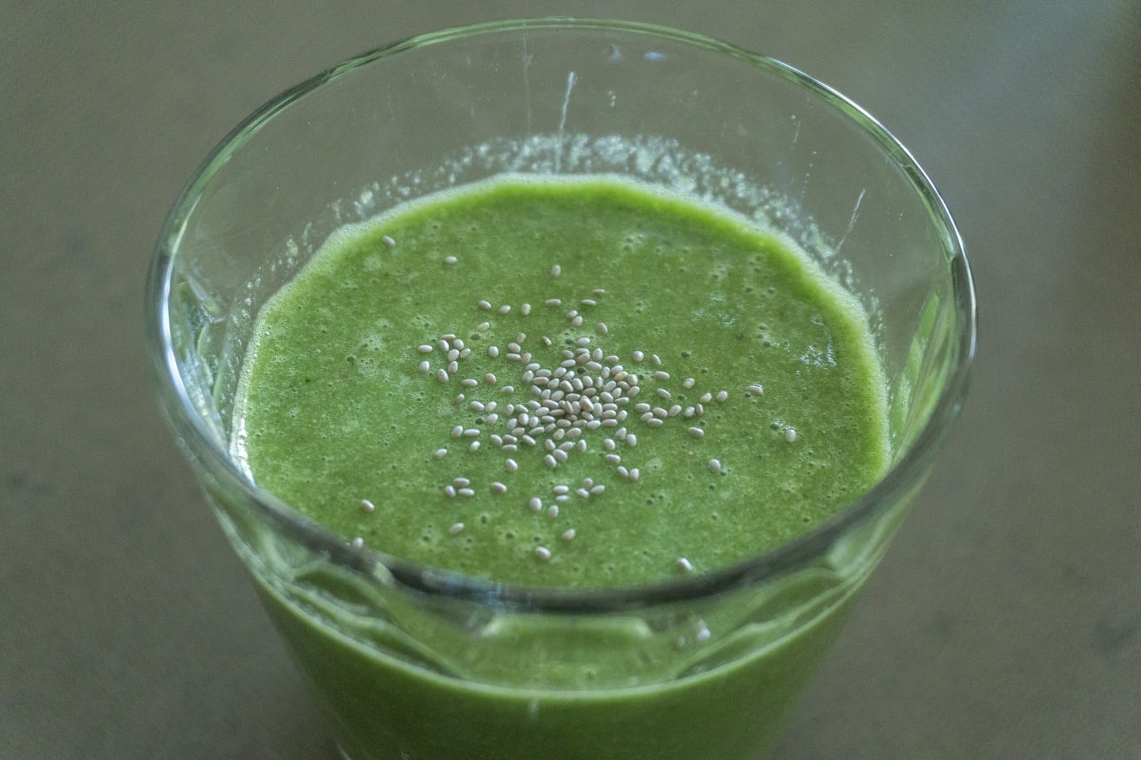 Green smoothie in a glass at a healthy cafe