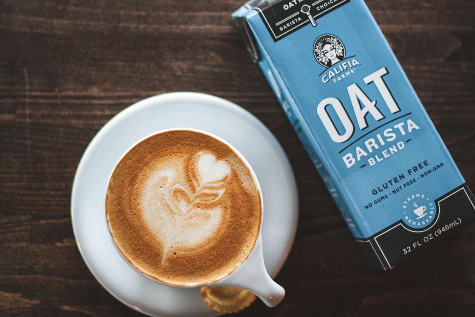 Oat-milk latte with leaf art in a Gold Coast cafe