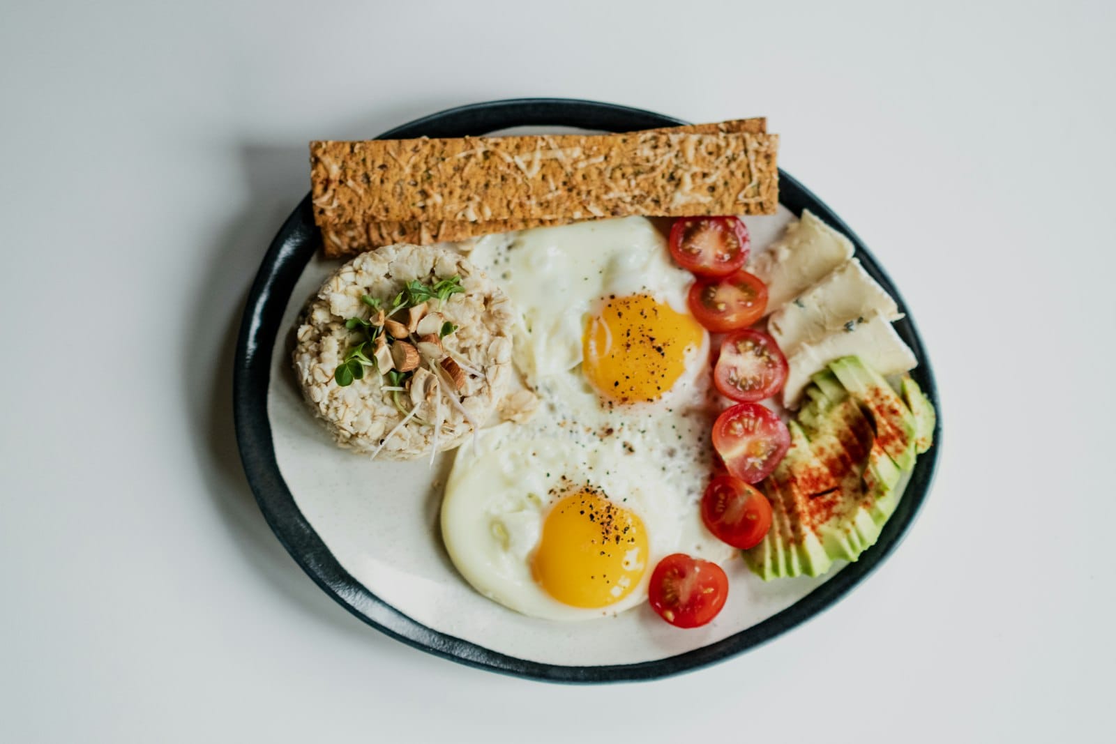 Brunch plate with eggs and greens at a Southport cafe