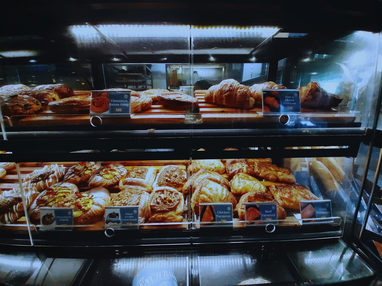 Fresh croissants and pastries at a cafe counter