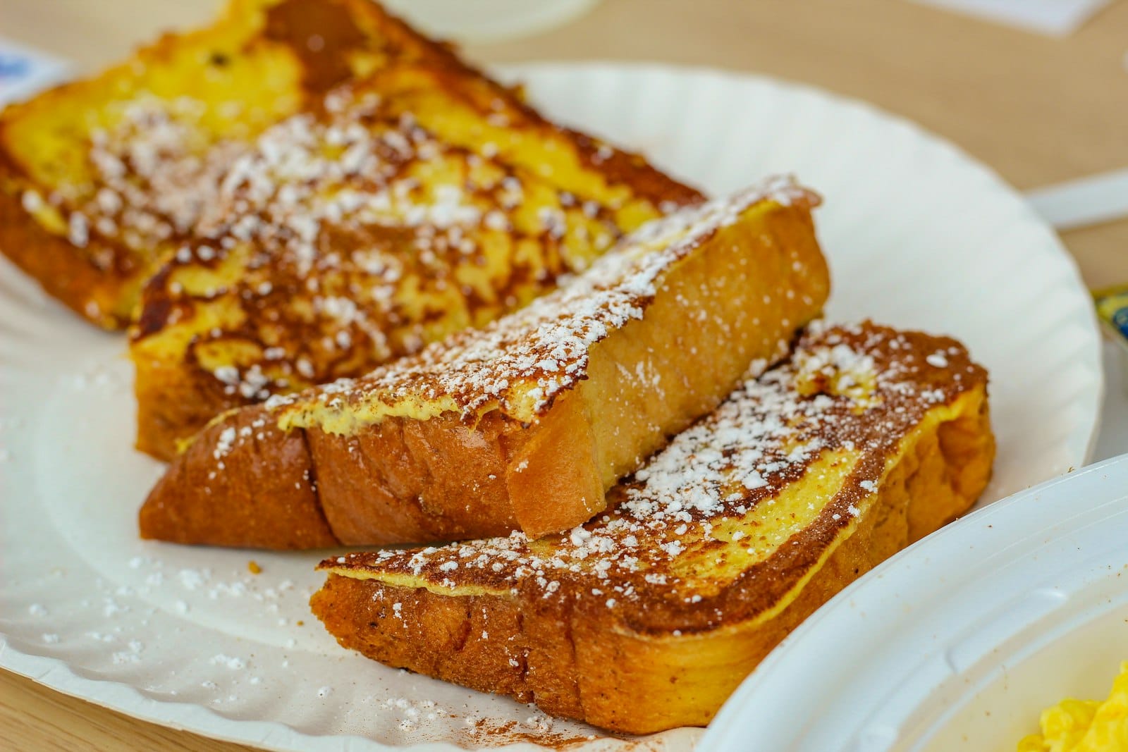 Golden French toast brunch plate with fruit and syrup
