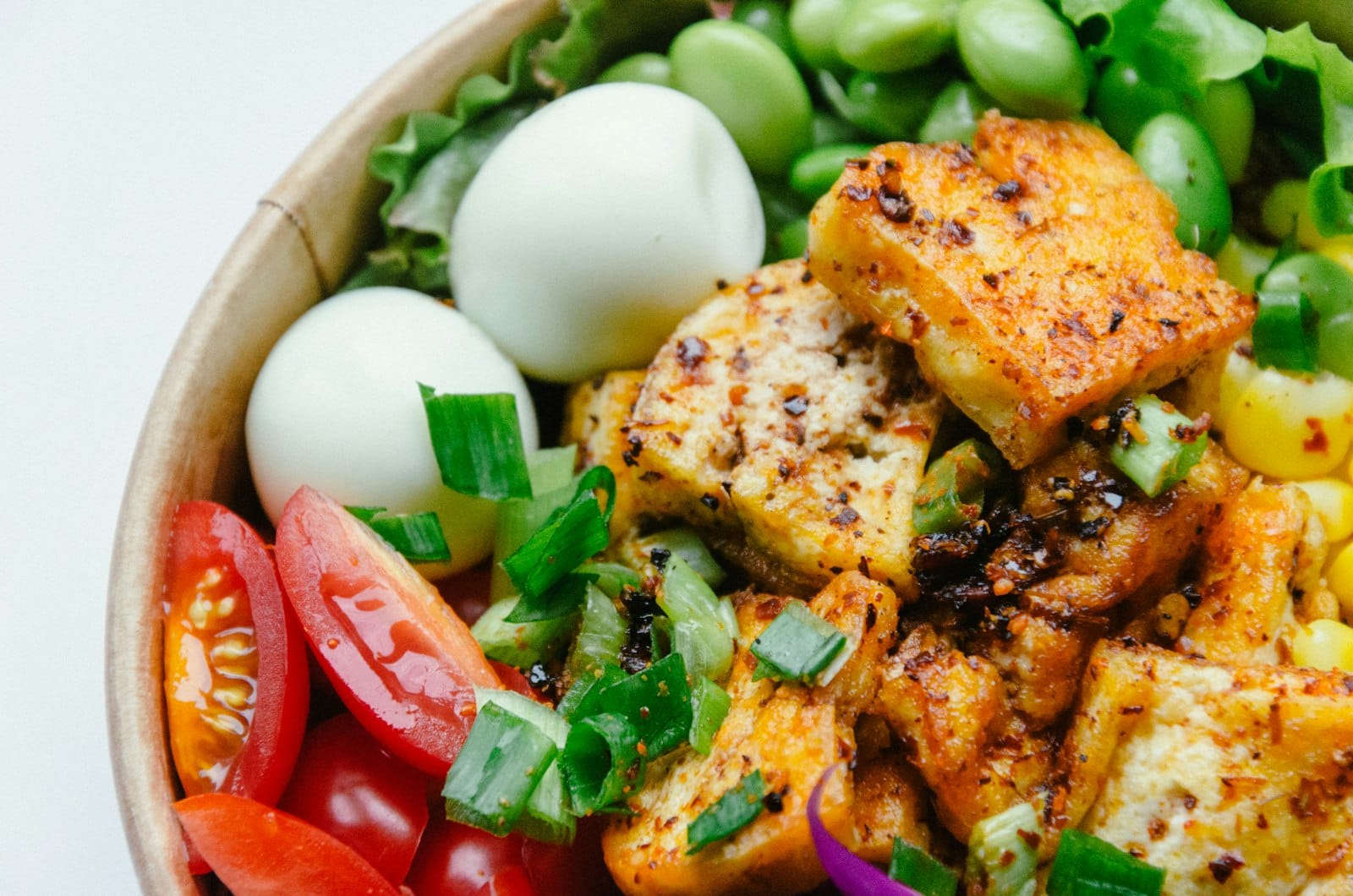 Tempeh served in a fresh salad bowl