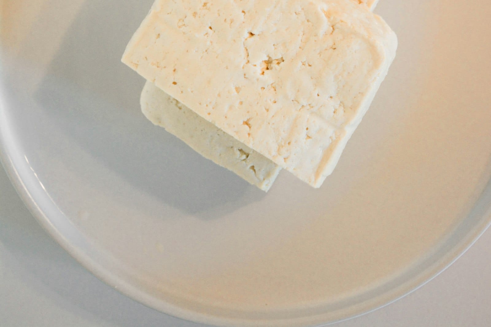Tofu, tempeh and seitan plant proteins arranged on a board