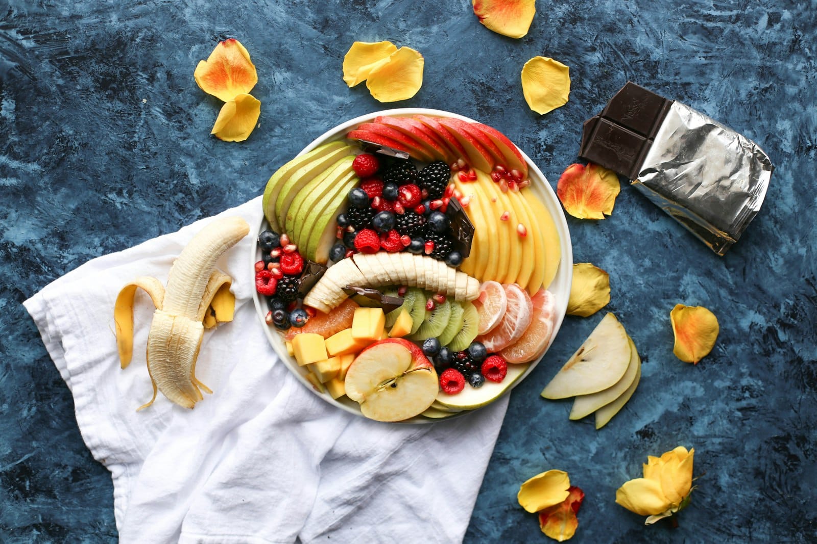 Vegan acai bowl topped with fresh fruit, granola and coconut