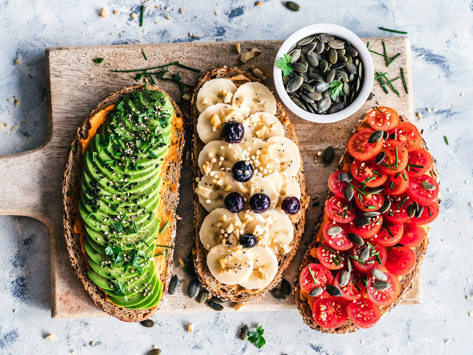 A spread of high-protein vegan foods including legumes, tofu and seeds