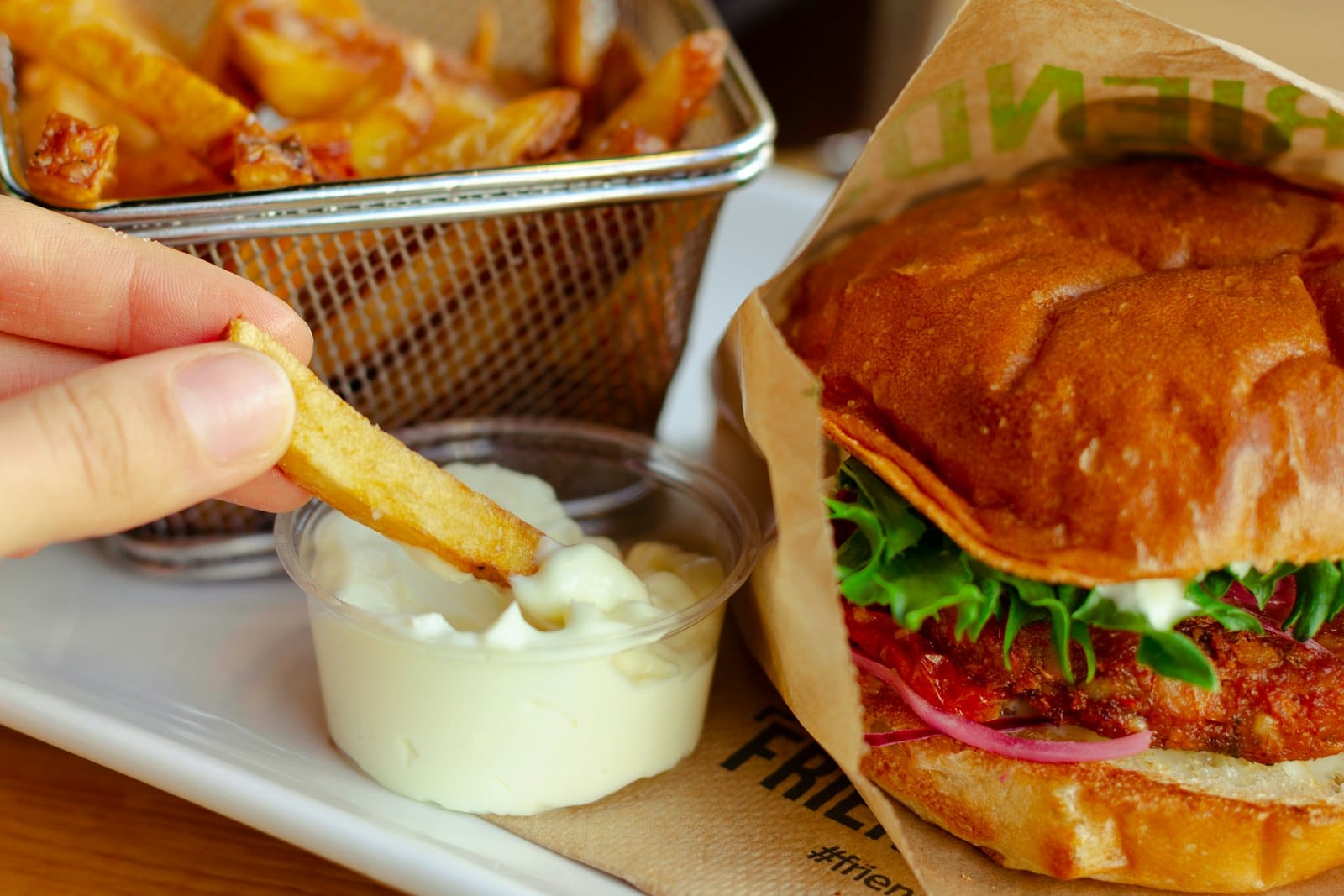 Plant-based vegan burger served with chips