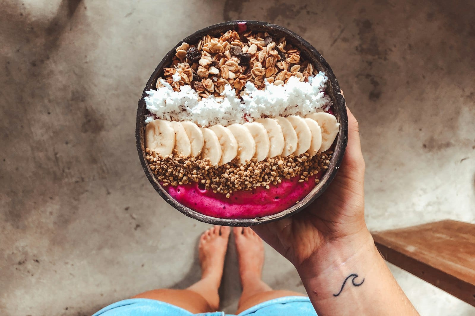 Vibrant vegan smoothie bowl topped with tropical fruit