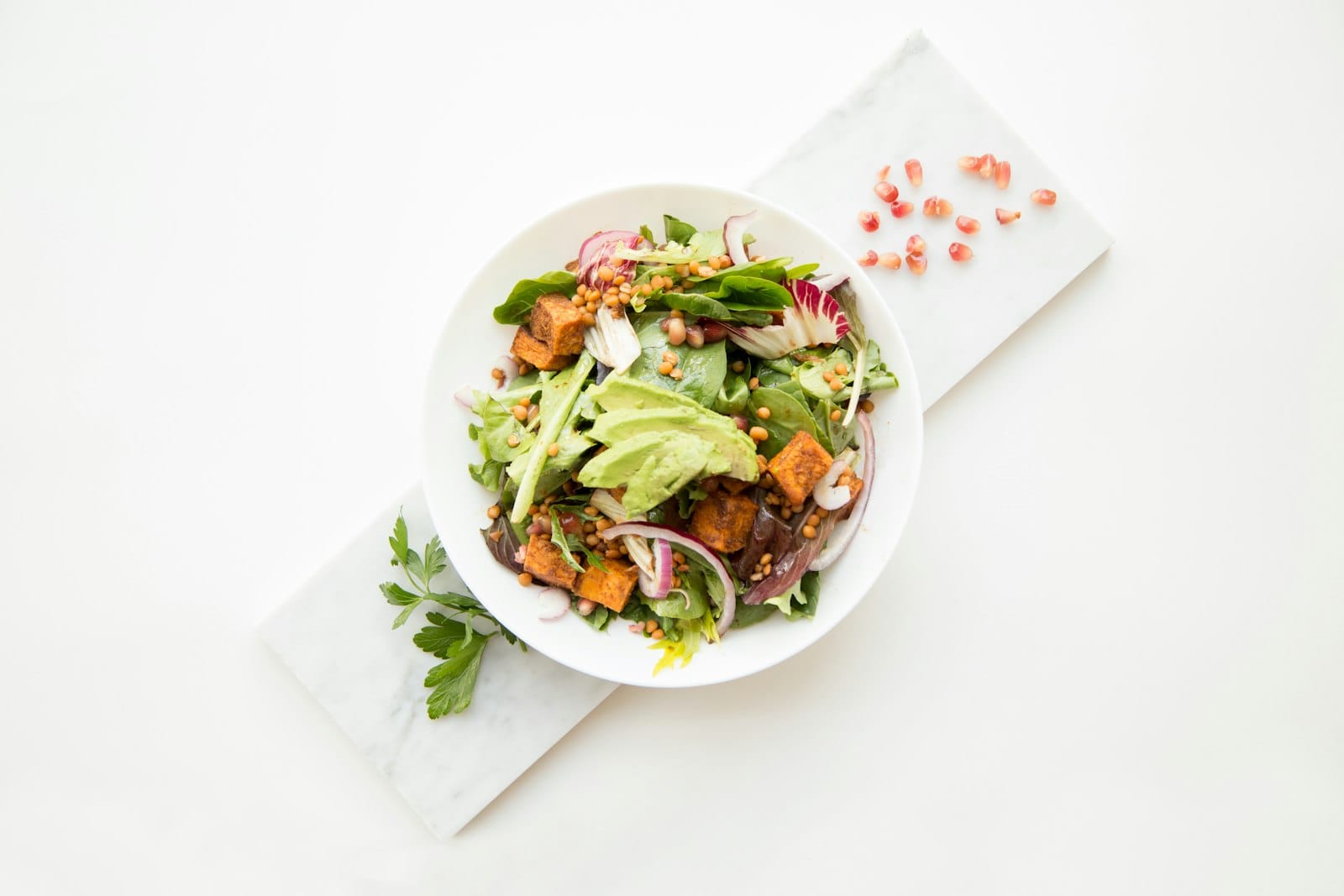Fresh vegetarian salad bowl with greens and vegetables
