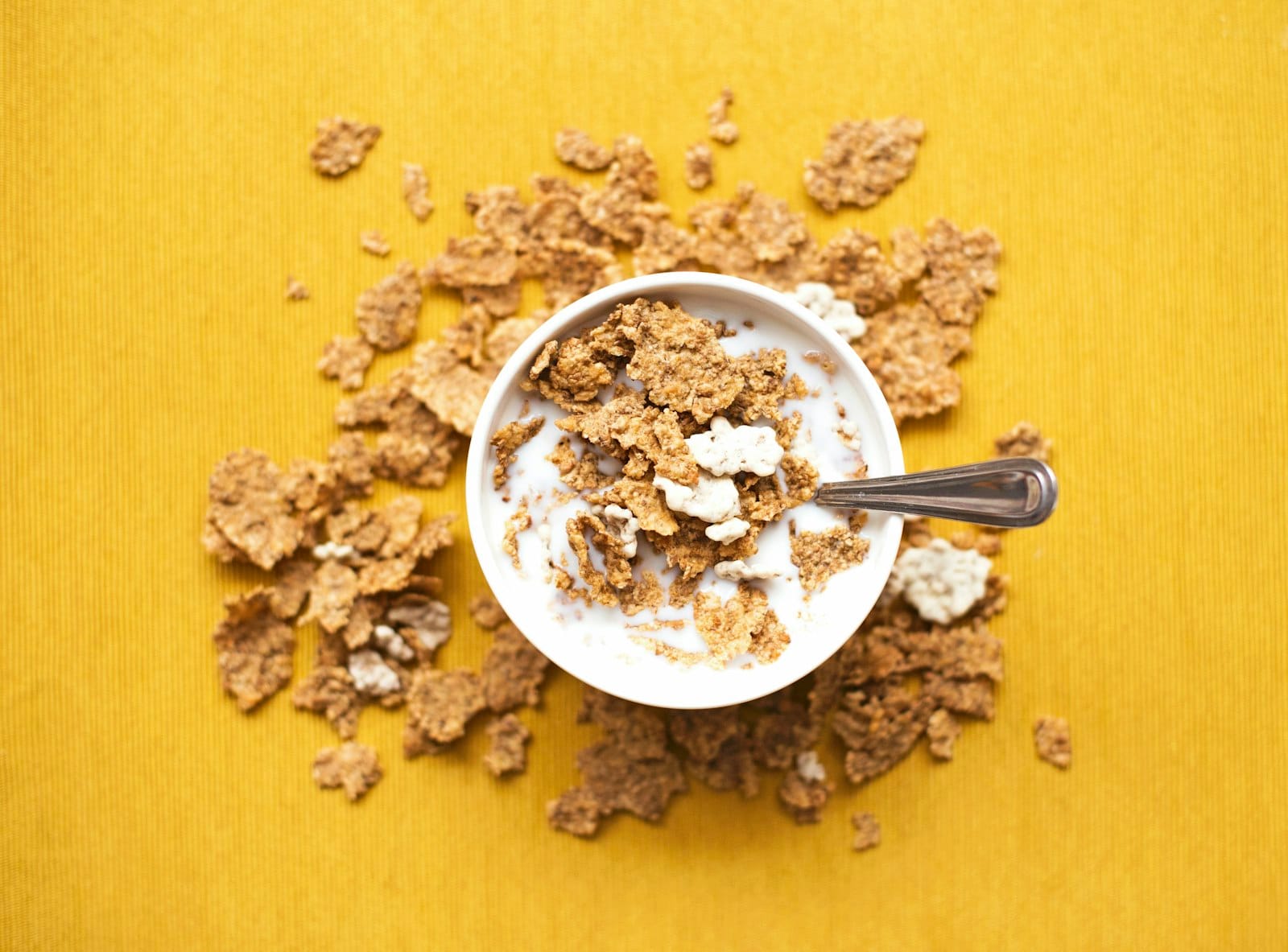 A bowl of breakfast cereal with milk