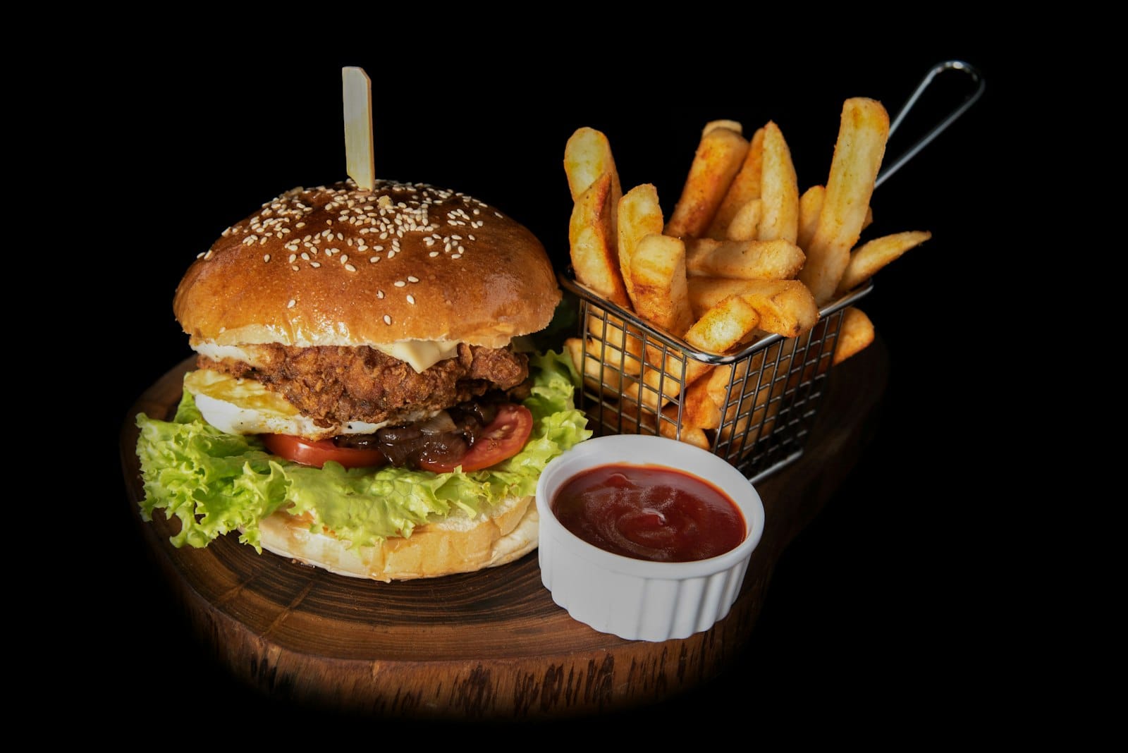 A stacked vegan burger with fries