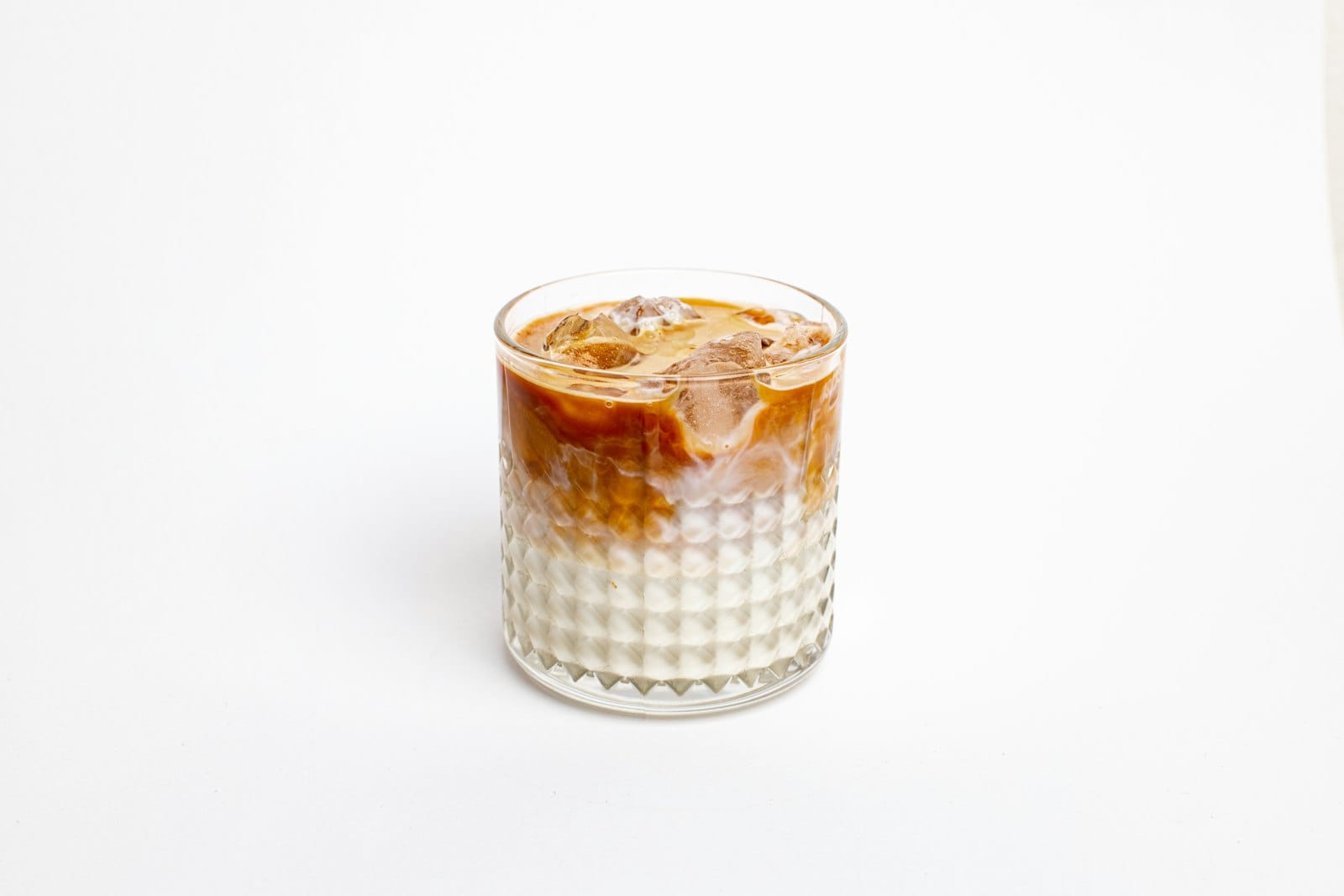 Iced coffee with oat milk in a glass