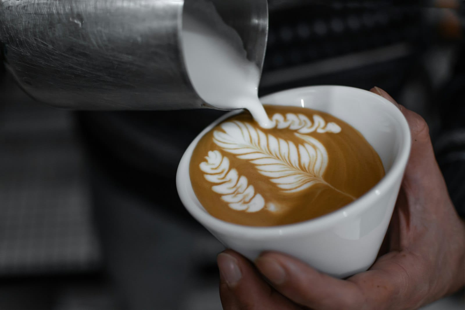 Latte art on an oat milk coffee