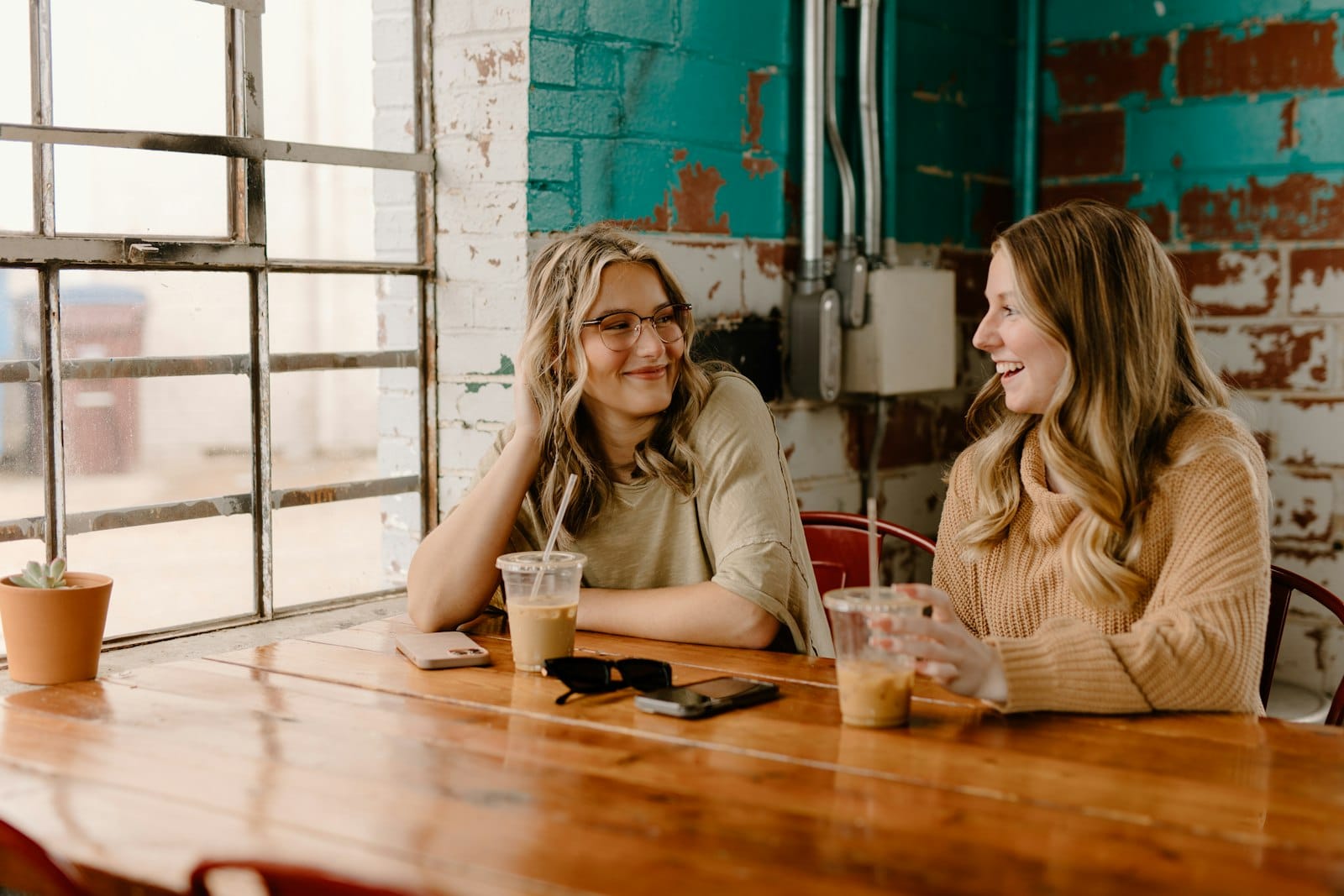 A group of friends seated at a cafe table