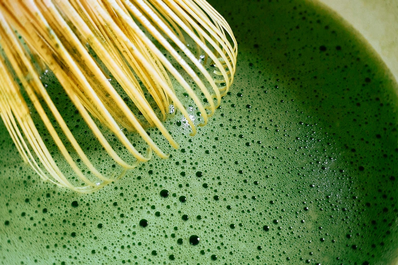 A traditional matcha whisk and bowl