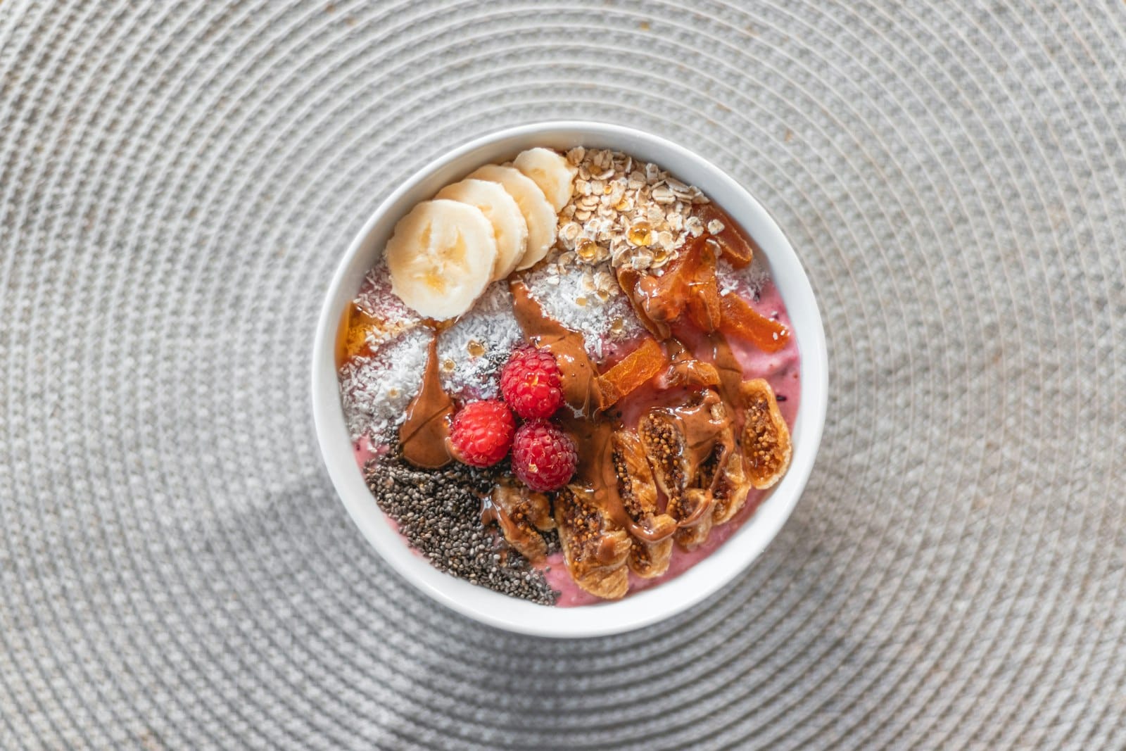 A healthy breakfast table with a smoothie bowl