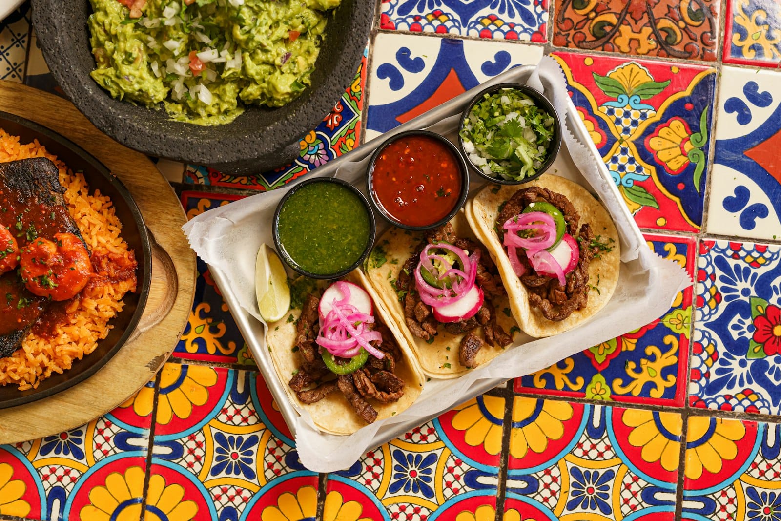 A taco platter shared at a table