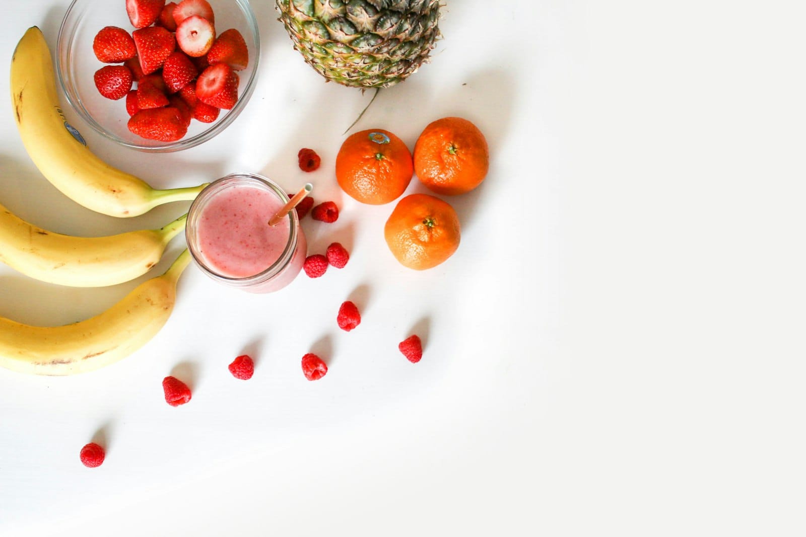 A smoothie bowl topped with fresh fruit