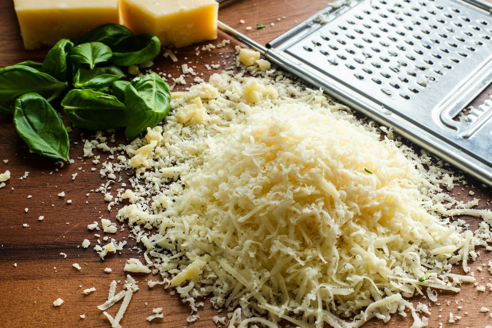 A bowl of shredded vegan cheese