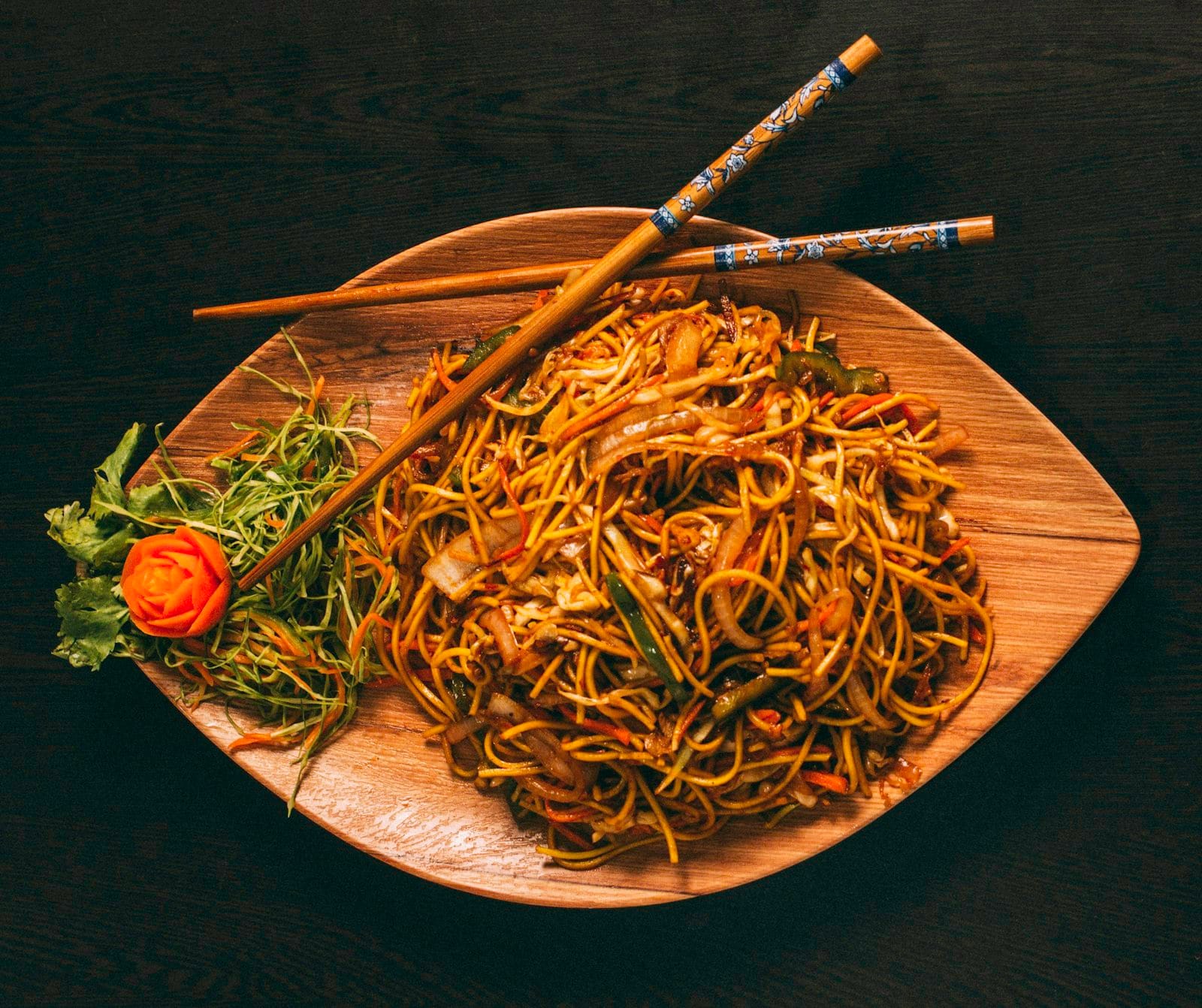 A stir-fry of noodles and vegetables
